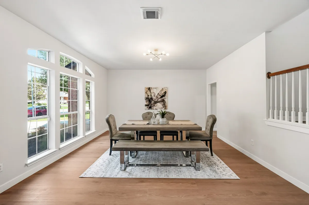 A bright dining room in a home we purchased and renewed